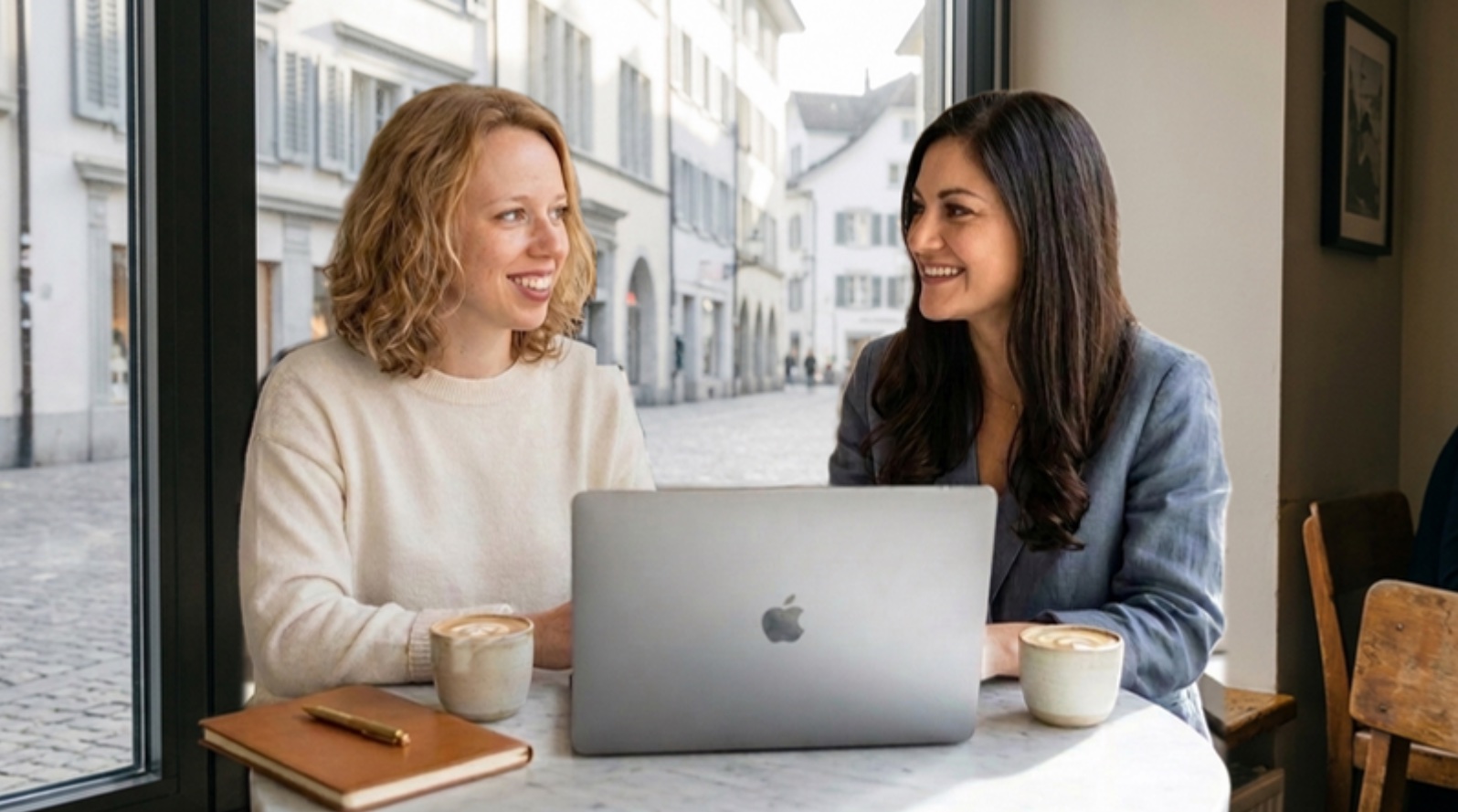 Leonie and Karina at a café table in Zurich's old town